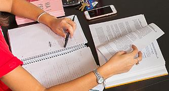 Photo of student writing in notebook